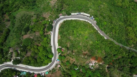 Aerial drone view of a winding mountain road in Barangay Cambuja, Pililla Stock Footage 342278364