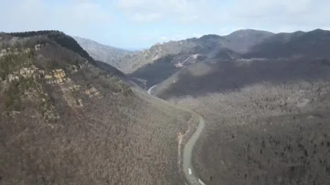 Aerial drone view of a winding river in the Caucasus mountains Stock Footage 337541671