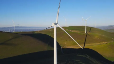 Aerial drone view of windmill on the green hill. Wind power plant near Live.. Stock Footage 232337160