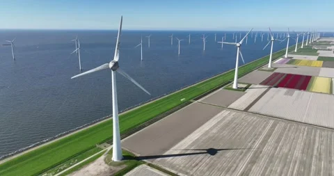 Aerial drone view of windmill turbines in The Netherlands generating green 스톡 동영상 256817751