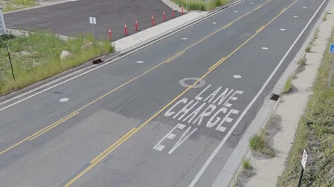 Aerial drone view of a wireless EV charging road in Salt Lake City Stock Footage 340264875