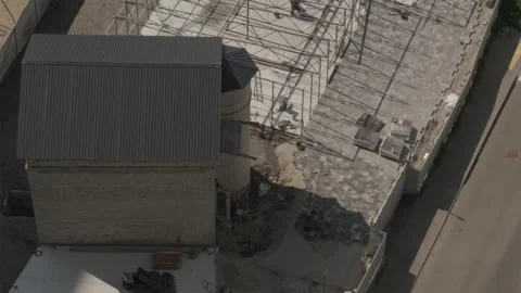 Aerial drone view of workers laying paving stones near residential house Stock Footage 339794820