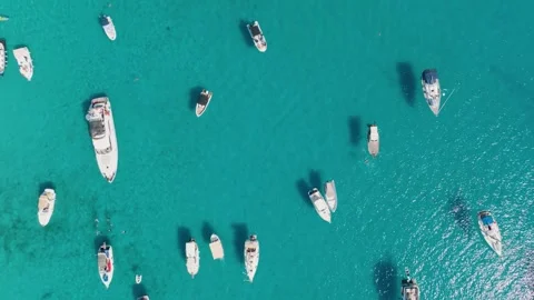 Aerial drone view of yachts and boats in a turquoise bay with azure water. Stock Footage 336977076