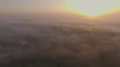 Aerial Drone View Yucatan Chichen Itza Mayan Pyramids Ruins at Sunrise Fog Stock Footage 241014842