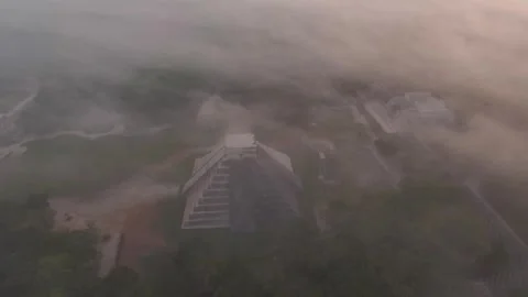Aerial Drone View Yucatan Chichen Itza Mayan Pyramids Ruins at Sunrise Fog Stock Footage 241014843