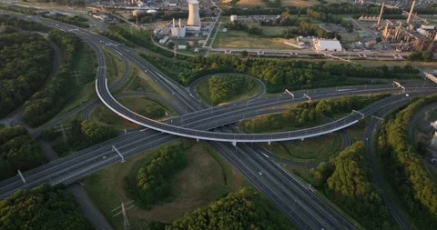 Aerial drone views of a cloverleaf intersection highway at dusk in the Stock Footage 250122404