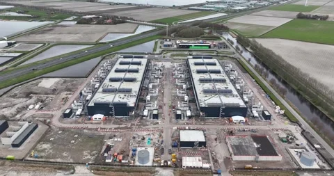 Aerial drone views the construction of a large scale big tech datacenter at Stock Footage 273012980