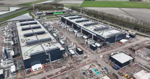 Aerial drone views the construction of a large scale big tech datacenter at Stock Footage 273325703