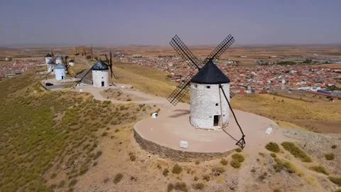 Aerial Drone Views of Consuegra Castle, Windmills and Spanish Town Stockbeeldmateriaal 335648189