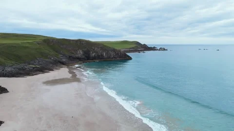 Aerial drone views Durness Beach reveal sands, turquoise waters and cliffs Stock Footage 304601844