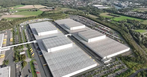 Aerial drone views of a large logistical trucking center, product warehouse Stock Footage 253635545
