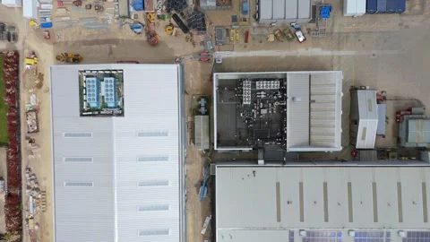 Aerial drone warehouse data centre fans business quantum computing UK England Stock Footage 308589028