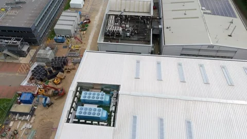 Aerial drone warehouse data centre fans business quantum computing UK England Stock Footage 308589283