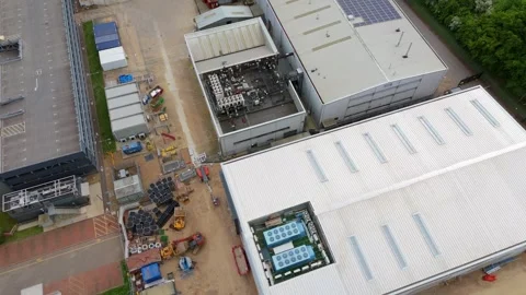 Aerial drone warehouse data centre fans business quantum computing UK England Stock Footage 308589287