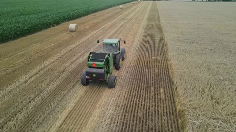 Aerial drone wheat straw baling Stock Footage 201493441