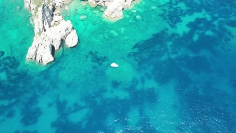 Aerial drone wiev various difficult maneuvers focus on boat Corfù Stock-Footage 162174250