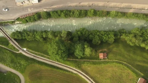 Aerial Drone of Winding Alpine River in Grindelwald, Switzerland Stock Footage 314662633