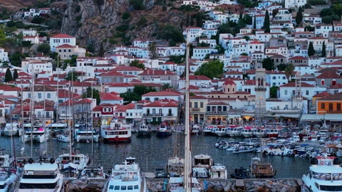 Aerial Drone Zoom View of Hydra Town Waterfront and Crowded Harbor at Dusk Stock Footage 344064585