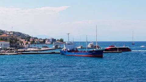 Aerial Drone Zoom View of Spetses Town Dapia Harbor With Ferry and Cargo Stock Footage 344460358