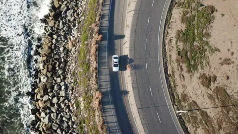 Aerial Drones view of a car in Ventura:  Exit on the CA-101 Stock Footage 303192053