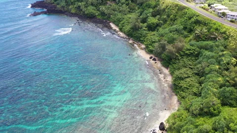 Aerial Drones view of the lush greenery and turquoise waters, Hideaway Beach Stock Footage 303041413