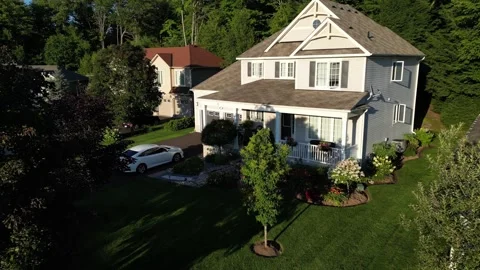 Aerial Drown Flight Around Tree of Home in Bracebridge Muskoka Ontario Stock Footage 314234003