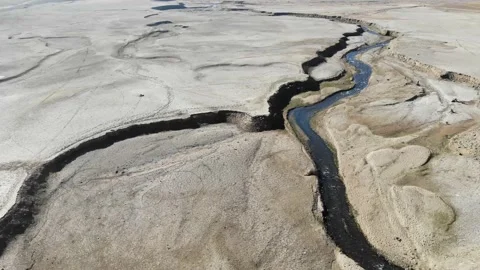 Aerial of dry lake surface Stock Footage 143940096