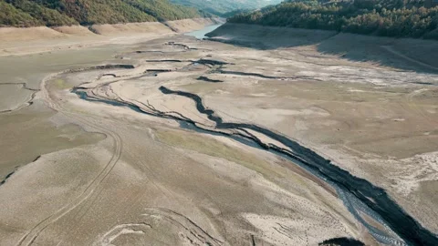 Aerial of dry lake surface with many cracks and empty paths Stock-Footage 166108151