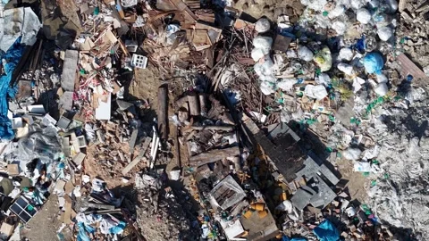 Aerial dump site overhead view showing mixed debris 스톡 동영상 329353050