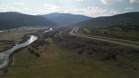 Aerial of Eagle River next to highway I70 through Vail Valley Colorado in spring Stock Footage 274083789