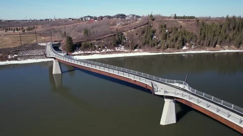 Aerial of Edmonton to Strathcona County Footbridge, Morning of April 6, 2025 Stock Footage 306319853