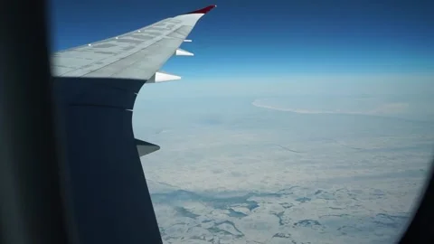 Aerial: eerie spotty ice pattern on icebergs off Canada coast during winter Stock Footage 235650509