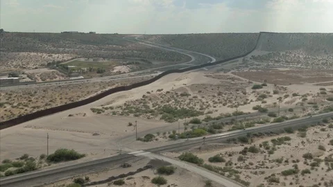 Aerial: El Paso border wall for Mexico &amp; USA Stock Footage 128935096