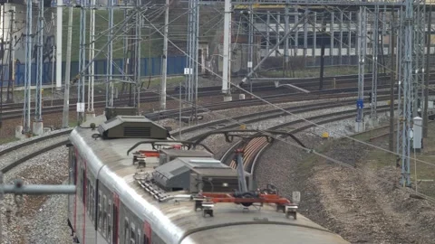 Aerial of Electric Passenger Train on Multiple Tracks Railway Stock Footage 130989592
