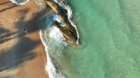 Aerial Elevating Drone Shot. Flying along the ocean coast. View of the sea waves Video stock 134324624