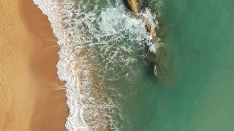 Aerial Elevating Drone Shot. Flying along the ocean coast. View of the sea waves Stock Footage 134324911
