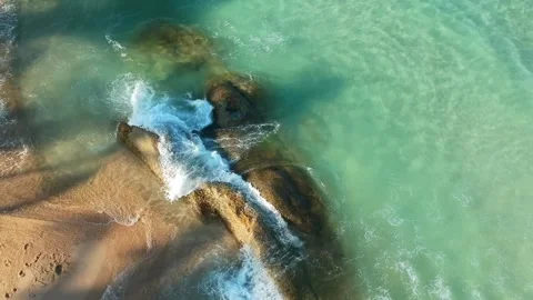 Aerial Elevating Drone Shot. Flying along the ocean coast. View of the sea waves Stock Footage 134325033