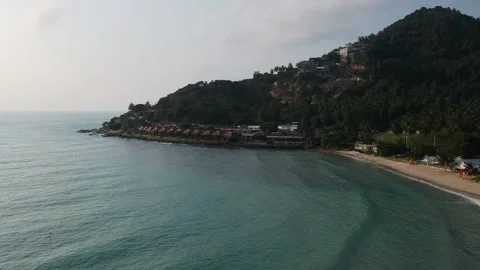 Aerial Elevating Drone Shot. Flying along the ocean coast. View of the sea waves Stock Footage 134325121