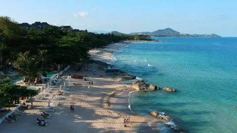 Aerial Elevating Drone Shot. Flying along the ocean coast. View of the sea waves Stock Footage 134325180