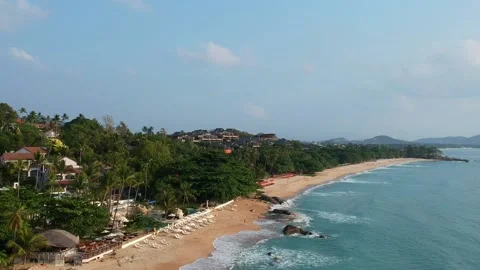 Aerial Elevating Drone Shot. Flying along the ocean coast. View of the sea waves Video stock 134325319