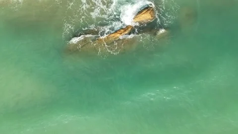 Aerial Elevating Drone Shot. Flying along the ocean coast. View of the sea waves Video stock 134325366