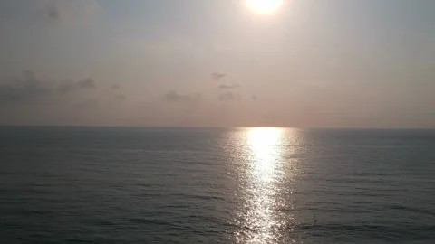 Aerial Elevating Drone Shot. Flying along the ocean coast. View of the sea waves Stock Footage 134325636