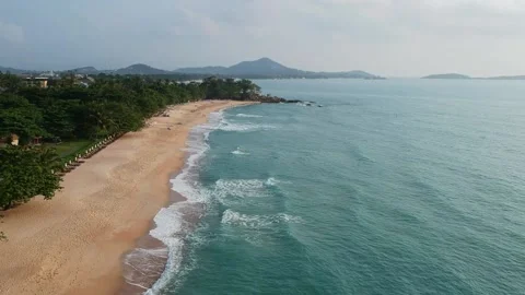 Aerial Elevating Drone Shot. Flying along the ocean coast. View of the sea waves 스톡 동영상 134325980