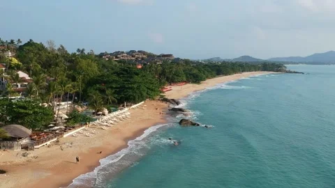 Aerial Elevating Drone Shot. Flying along the ocean coast. View of the sea waves Stock Footage 134326227