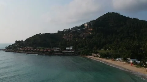 Aerial Elevating Drone Shot. Flying along the ocean coast. View of the sea waves Video stock 134326595