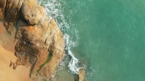 Aerial Elevating Drone Shot. Flying along the ocean coast. View of the sea waves Video stock 134335706