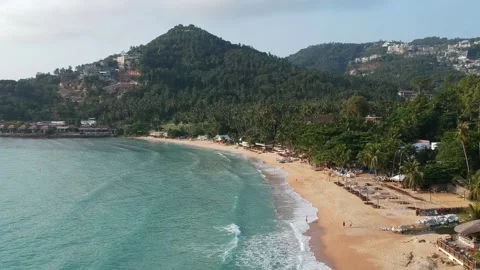 Aerial Elevating Drone Shot. Flying along the ocean coast. View of the sea waves Video stock 136830542