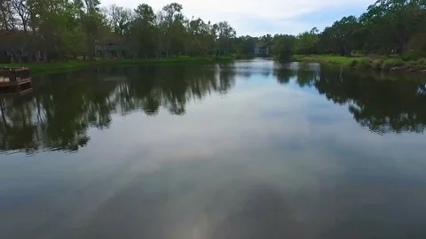 Aerial Elevating Shot Flying Over Lake at Golf Resort Stock Footage 129975050