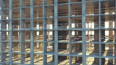 Aerial elevator shot of a concrete frame of a building under construction Stock Footage 219899854