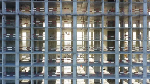 Aerial elevator shot of a concrete skeleton of a building under construction Stock Footage 139071471